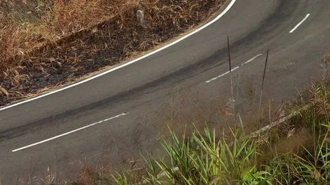 Close View of Curved Mountain Road With Dry Hillside Stock Footage 329839837