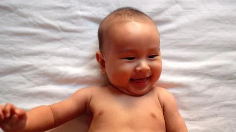Close-up view of cute asian baby's smiling face Stock Photos