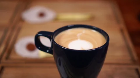 Close up view on cute heart latte art with milk on cappuccino coffee cup Stock Footage 103992846