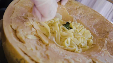 Close up view of cutting Parmesan cheese, loaf segment with rind, mature 스톡 동영상 108726729