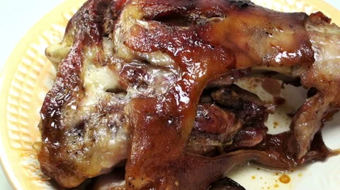 Close-up view of cutting a piece of roasted meat on a plate Stock Footage 61219718