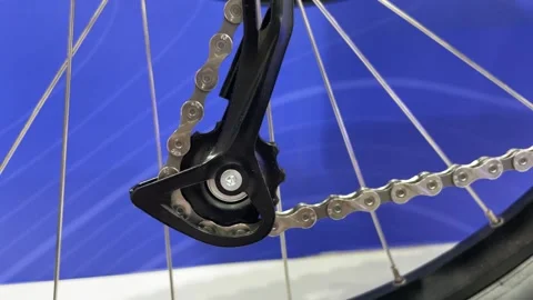 Close up view of cycle gears moving with blue background under studio setup. Stock Footage 308220008