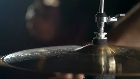 Close-up view of cymbals in drum kit and man musician playing with drumsticks. Video stock 240562955