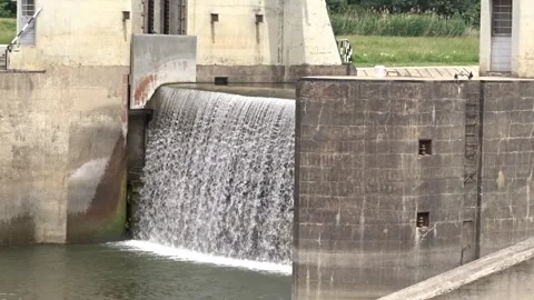 Close view of dam spillway water flow with birds Stock Footage 336195487