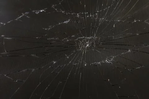 Close-up view of dark grey slanted broken lcd screen with visible pixel grid and 库存照片