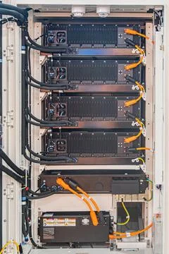 Close-up view of a dark, industrial server rack with multiple modular units.. 写真素材