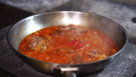 Close up view on delicious chicken stew vegetable ragout in hot sauce on white Stock Footage 106815647