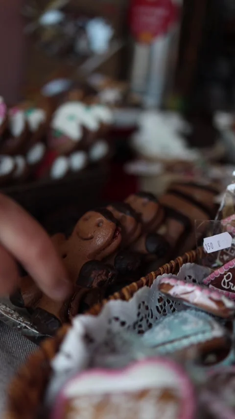 A close-up view of delicious gingerbread cookies shaped like smiling figures, di Stock Footage 293466123