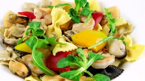 Close-up view of delicious Seafood pasta with shrimps, mussels, arugula Stock Footage 73654563