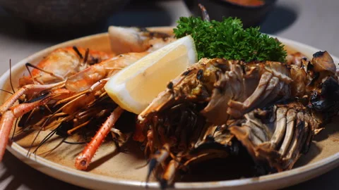 Close-up view of delicious seafood platter featuring grilled shrimps, Stock Footage 280021159