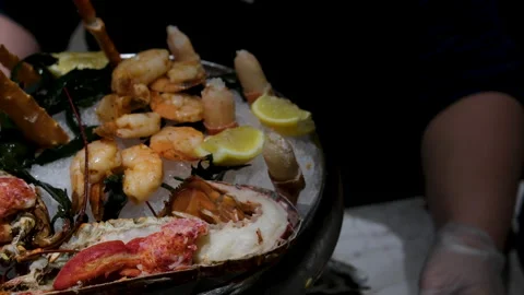 Close-up view of delicious seafood platter featuring grilled shrimps, lobsters Stock Footage 302088759
