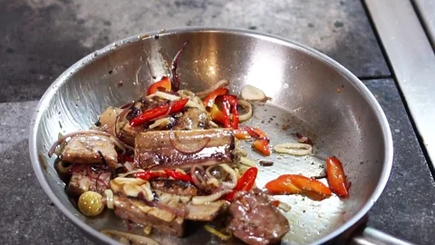 Close up view on delicious vegetables mixed with hot oily pork ribs meat slices Stock Footage 106812232