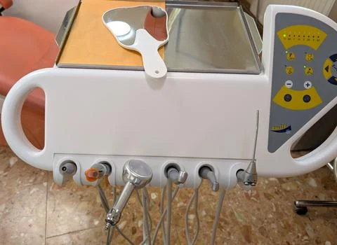 Close-up view of a dental unit control panel with multiple dental handpieces Stock Photos