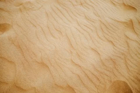 Close-up view of desert sand. Stock Photos