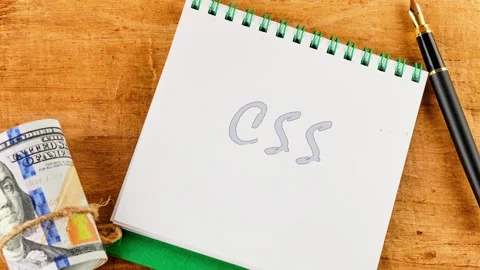 A close up view details the progression of writing the letters CSS. Faint Stock Footage 328072734