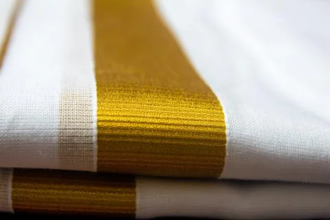 Close view of the dhoti with gold threaded border. Stock Photos
