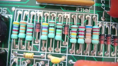 Close up view of different frequency resistors on motherboard. Stock Footage 172528716
