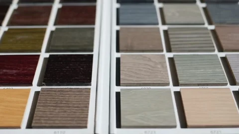 A close up view of different shades of wood samples displayed in a book, fe.. Stock Footage 334993276
