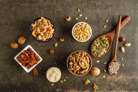 Close-up view of different types of nuts in bowls Stock Photos