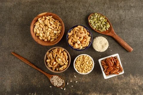Close-up view of different types of nuts in bowls Stock Photos