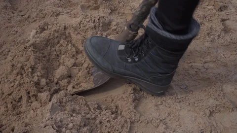 Close-up view, digging sand by shovel. Video stock 129318568