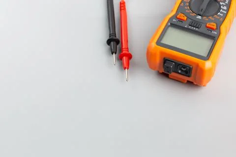 Close-up view of digital electrical multimeter with probe tips Photos