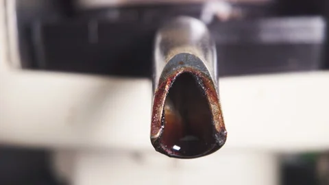 Close up view of dirty coffee machine spout with visible residue and wear 库存影片 336202609
