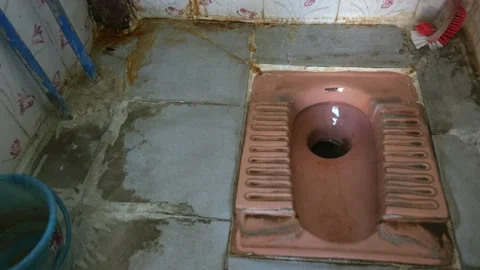 A close view of a dirty Indian-style toilet or squat toilets Stock Footage 234302669