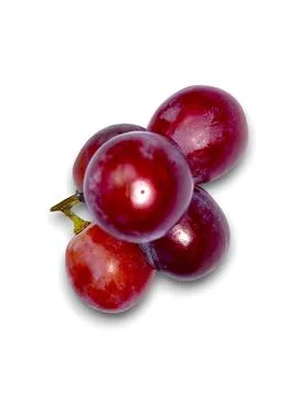 Close view displaying shiny red globe grapes and stems on a bright white ba.. Foto stock