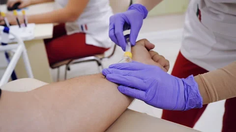Close up view of doctor is doing EKG, electrocardiogram in the clinic. Weight Stock Footage 142963893