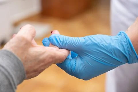 Close up view of a Doctor using glucosmeter, checking blood sugar level fr... 写真素材