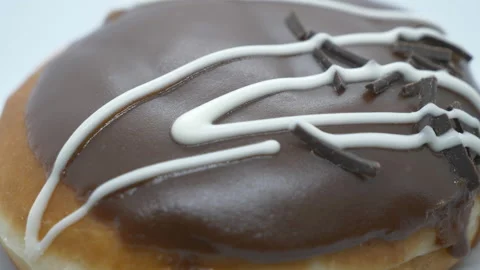 A close up view of a donut with chocolate grazing. Stock Footage 201212338