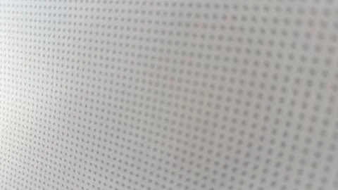 Close up view of dotted fabric surface with soft light and fine pattern. Stock Photos