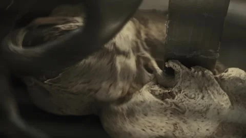Close up view of dough mixture being processed in large industrial mixer machine Stock Footage 341656898