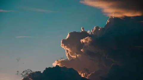 Close-up view of dramatic cumulonimbus clouds illuminated by sunlight Stock Photos