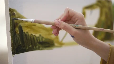 Close up view of drawing process. Female artist painting oil picture. Stock Footage 76745253
