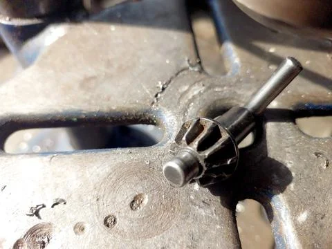 Close-up View of a Drilling Machine Chuck Key on a Metal Surface During Mec.. Stock Photos
