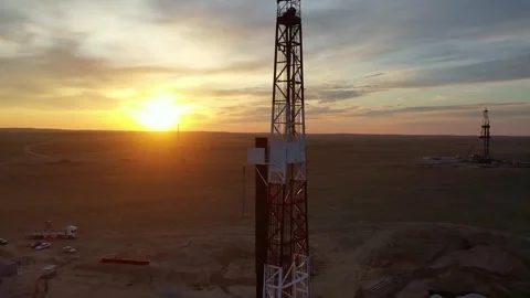 Close view of drilling rig at sunset in active gas field. Stock Footage 334584116