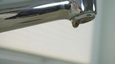 Close-up view of a dripping tap Stock Footage 97069886