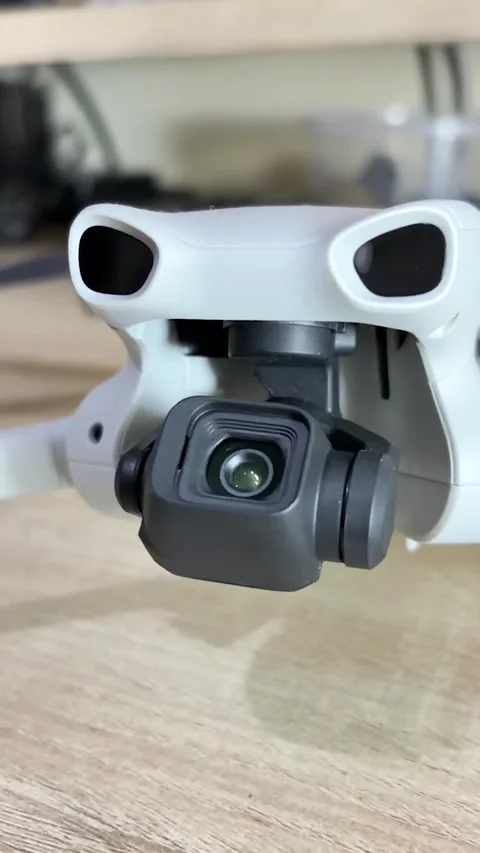 Close Up View of Drone Camera Lens and Mechanical Gimbal Stabilizer Stock Footage 345954039