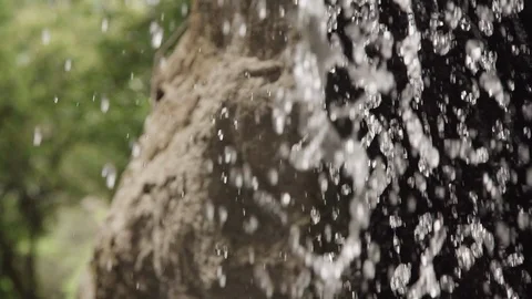Close view of drop of water falling down from cliff in natural area. Stock Footage 119900147