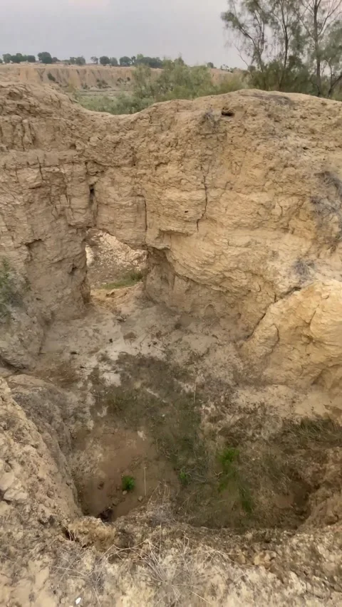 Close-up view of dry and cracked soil forming natural mounds in a rural village  스톡 동영상 343621588