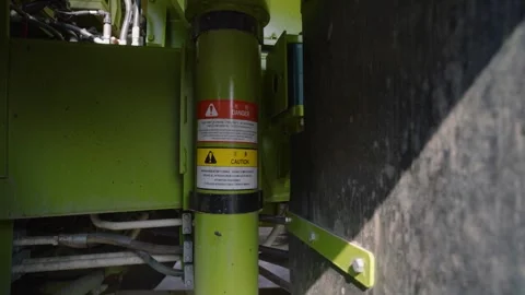 Close-up view of a dump truck hydraulic cylinder on heavy mining equipment at 스톡 동영상 331795259