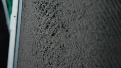 Close view of a dusty mesh screen with heavy dirt buildup, Dusty mesh scree.. Vídeo Stock 338319361