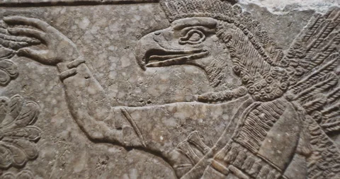 Close-up view on Eagle-headed Winged Figure And Sacred Trees. Architectural Stock Footage 281244536