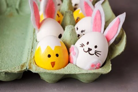 Close up view of Easter decorative eggs, bunnies ans chicks in cardboard Stock Photos