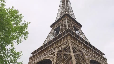 Close-up view of the Eiffel Tower from Eiffel Tower Garden, Paris, France.	 Stock Footage 308740471