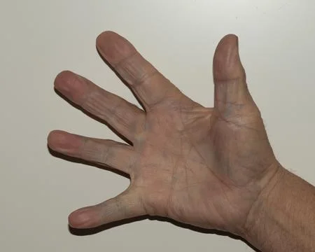Close-up view of an elderly, fully open hand against a neutral background, .. 写真素材