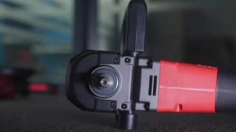 Close up View of Electric Angle Grinder on Dark Surface 스톡 동영상 329615584