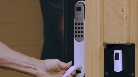 Close up view of an electric combination lock on a black door. Interior design. Stockbeeldmateriaal 118139785